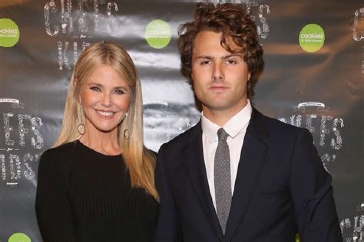 Christie Brinkley and son Jack pose in swimsuits on the beach